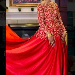 A beautiful Bollywood red gown with a train. Comes with an optional petticoat.
